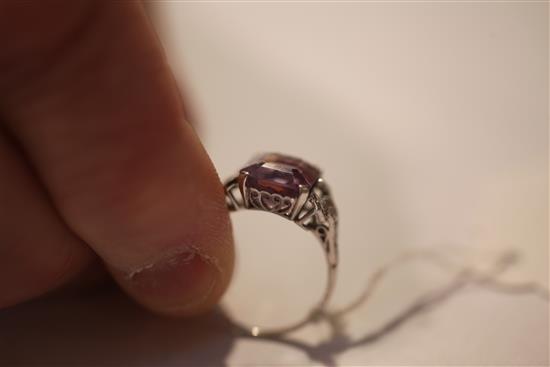 A 1920s/1930s platinum, amethyst and diamond ring, size O.